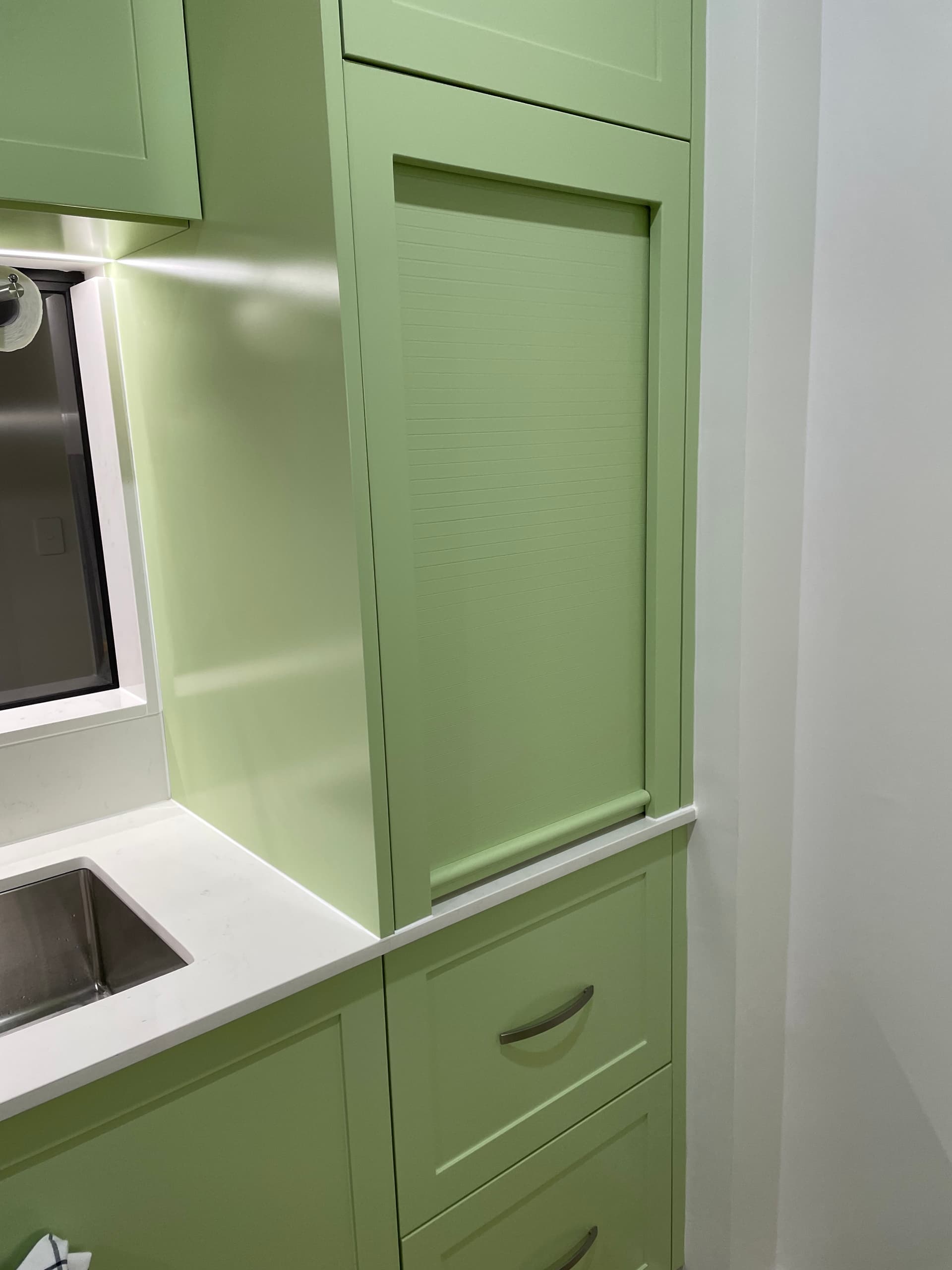 Light green shaker-style kitchen