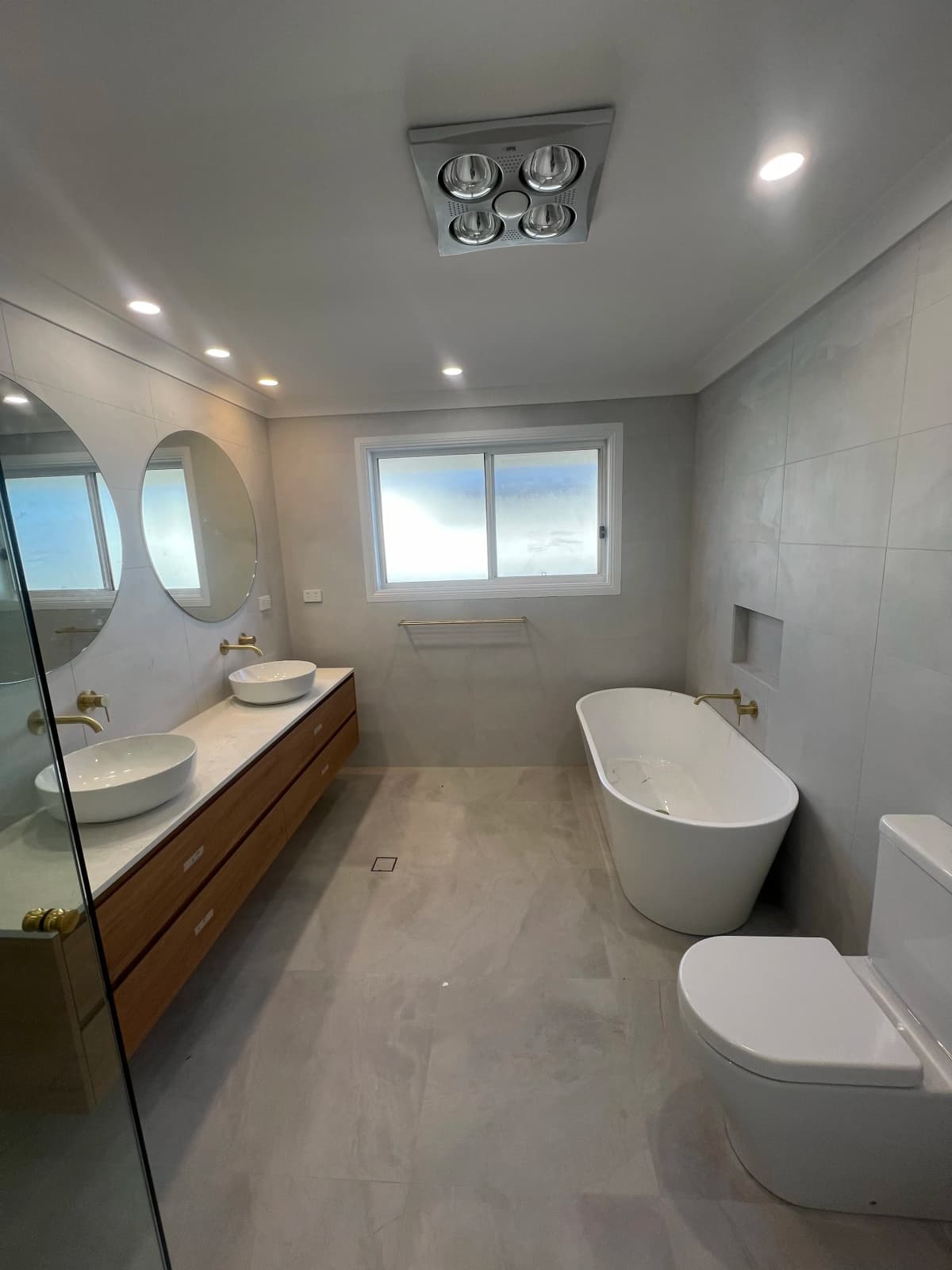 Modern double sink bathroom renovation in Sydney apartment with premium fixtures and finishes