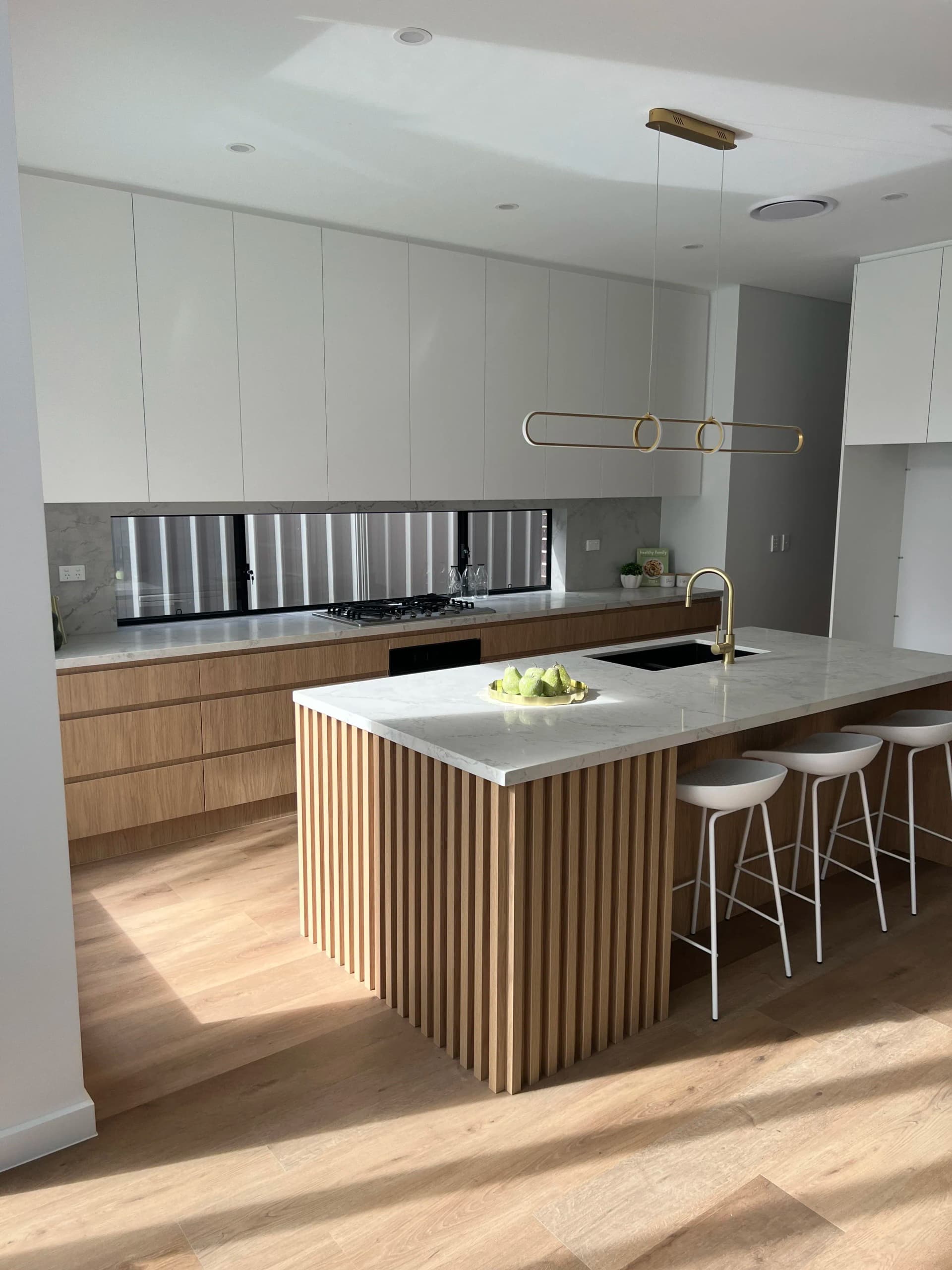 Kitchen with gold fixtures alternate view