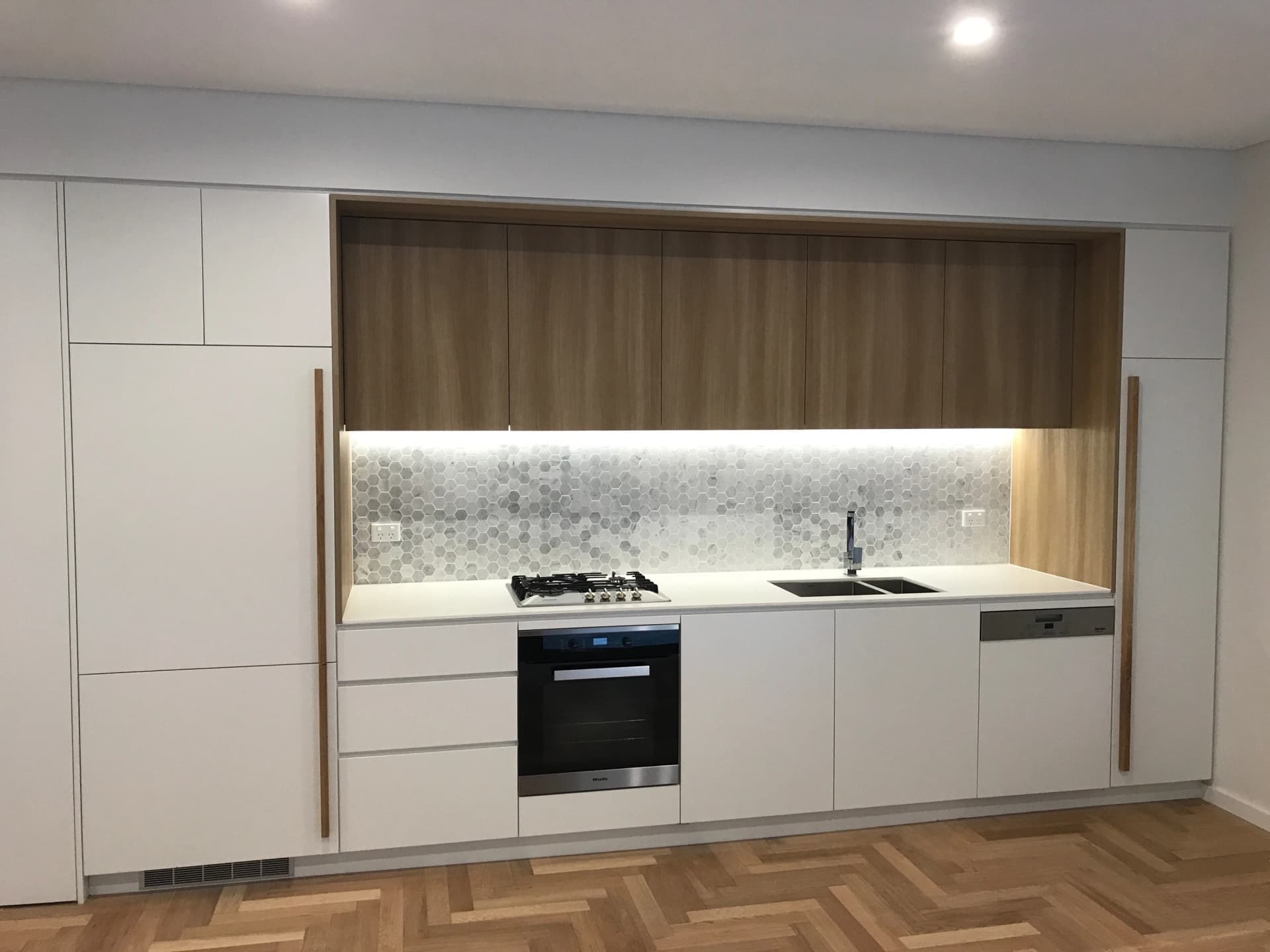 Kitchen with hexagonal tile feature