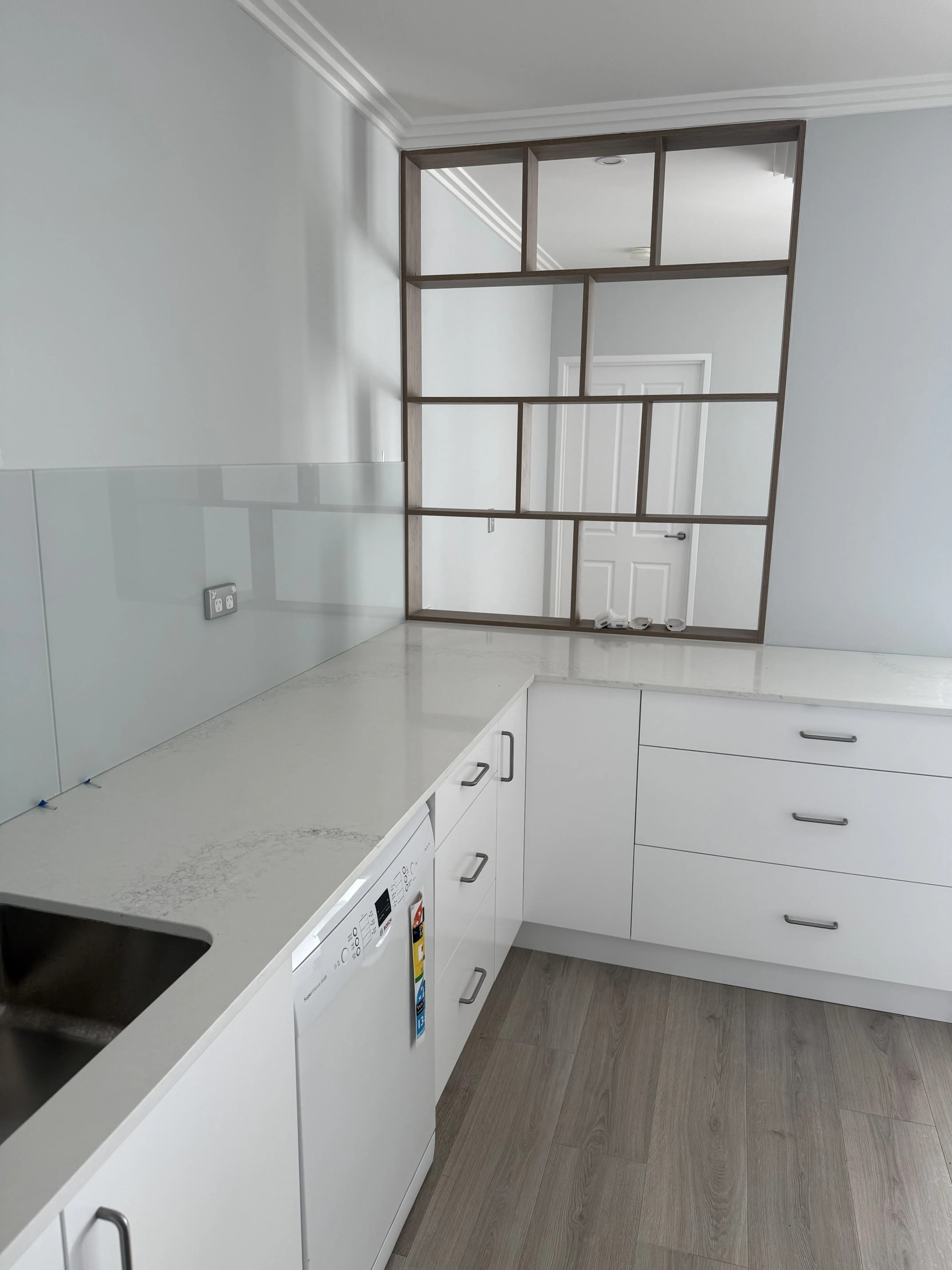 Modern kitchen with dark shelving